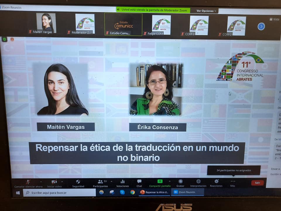 La imagen muestra una captura de pantalla de la videoconferencia en la que se presentaron Maitén Vargas y Erika Cosenza. Se muestra el logo de ABRATES, una foto de Maitén y una foto de Erika y el título de la ponencia: «Repensar la ética de la traducción en un mundo no binario»